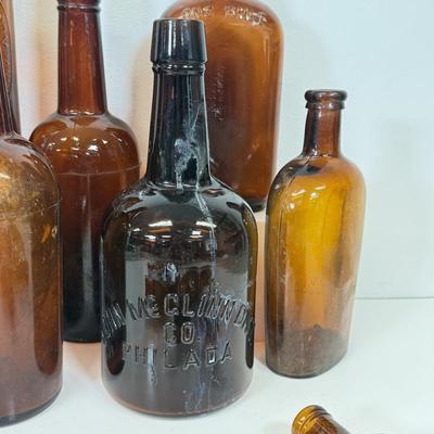 LOT 28: Vintage Brown Glass Flasks & Bottles