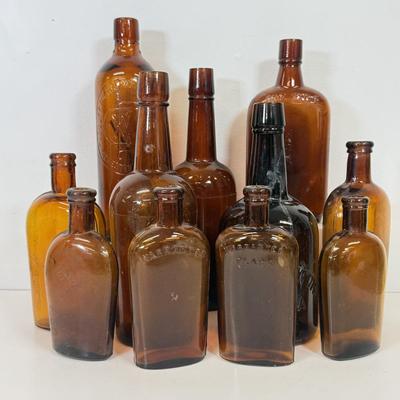 LOT 28: Vintage Brown Glass Flasks & Bottles