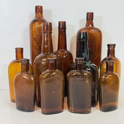 LOT 28: Vintage Brown Glass Flasks & Bottles
