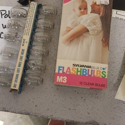 Sale Photo Thumbnail #954: Excellent condition. Polaroid 101, case, cold meter thingie, flashbulbs, book