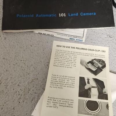 Sale Photo Thumbnail #951: Excellent condition. Polaroid 101, case, cold meter thingie, flashbulbs, book