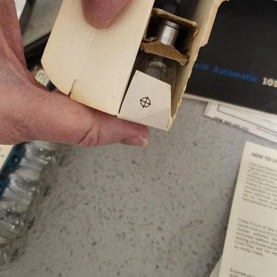 Sale Photo Thumbnail #953: Excellent condition. Polaroid 101, case, cold meter thingie, flashbulbs, book