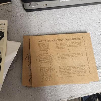 Sale Photo Thumbnail #952: Excellent condition. Polaroid 101, case, cold meter thingie, flashbulbs, book