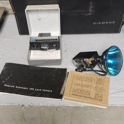 Sale Photo Thumbnail #965: Polaroid Automatic 100 with case and accessories.