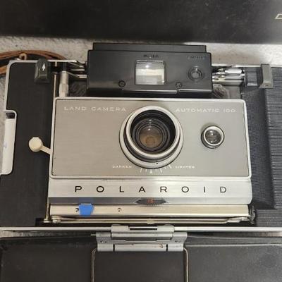 Sale Photo Thumbnail #964: Polaroid Automatic 100 with case and accessories.