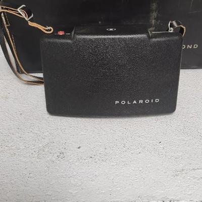 Sale Photo Thumbnail #959: Polaroid Automatic 100 with case and accessories.