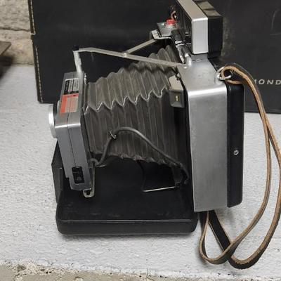 Sale Photo Thumbnail #963: Polaroid Automatic 100 with case and accessories.