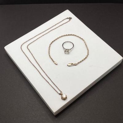 LOT 401: Sterling Jewelry - Cubic Zirconia Ring Sz 7.5, Pendant Necklace 18" and Bracelet 8"