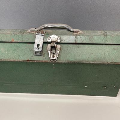 Green metal toolbox with wrenches