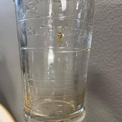 Fruitcake tin, cherry pop can and Eastman Kodak Co glass beaker