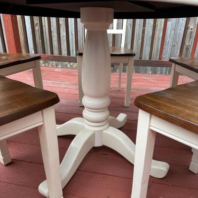 Sale Photo Thumbnail #13: 42” round dark wood dining table with matching set of 5 chairs.