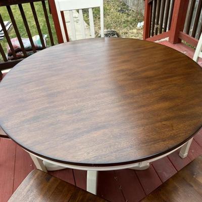 Sale Photo Thumbnail #11: 42” round dark wood dining table with matching set of 5 chairs.