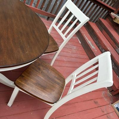 Sale Photo Thumbnail #12: 42” round dark wood dining table with matching set of 5 chairs.