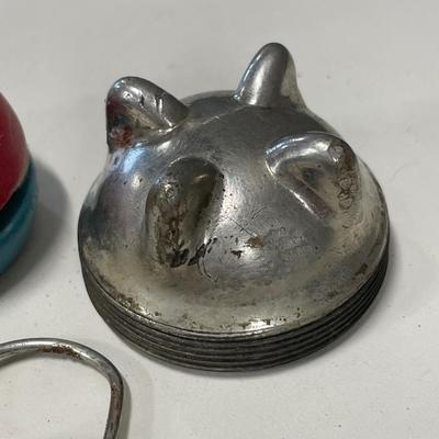 Radiator cap, yo-yo and Mobil key ring