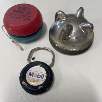 Radiator cap, yo-yo and Mobil key ring