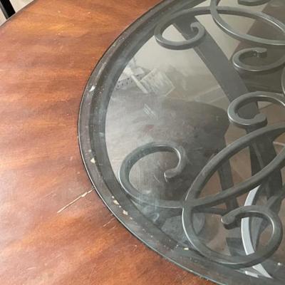 Sale Photo Thumbnail #27: Dark brown dining table with 5 matching chairs. Center has a glass inlay that shows off the table’s rustic design. 

Table has a superficial crack and a visible scratch in it as shown in the pictures. The crack has no impact on the integrity of the tabl
