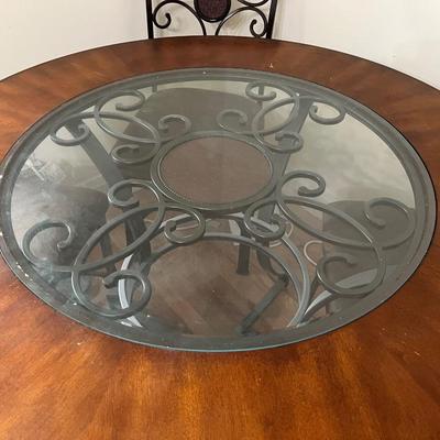 Sale Photo Thumbnail #25: Dark brown dining table with 5 matching chairs. Center has a glass inlay that shows off the table’s rustic design. 

Table has a superficial crack and a visible scratch in it as shown in the pictures. The crack has no impact on the integrity of the tabl