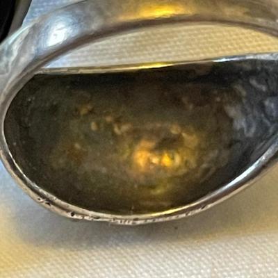 TWO LADIES RINGS. ONE LADIES STERLING SILVER RING ONE BLACK STONE SILVER TONE RING