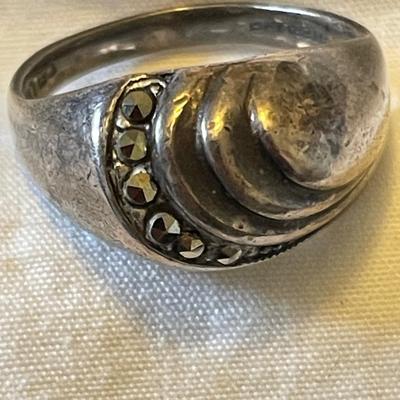 TWO LADIES RINGS. ONE LADIES STERLING SILVER RING ONE BLACK STONE SILVER TONE RING