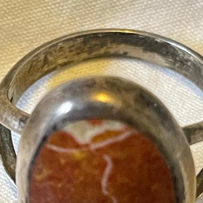 LADIES STERLING RING WITH ORANGE SPINY STONE AND AN ENAMELED BAND