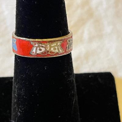 LADIES STERLING RING WITH ORANGE SPINY STONE AND AN ENAMELED BAND