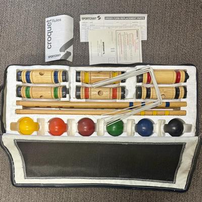 Sale Photo Thumbnail #414: Made by Sportcraft, in near-new condition. 4 mallets, 4 balls, and a set of white wire wickets in a zippered storage case.