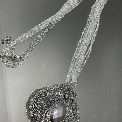 Silver tone necklace and earrings set