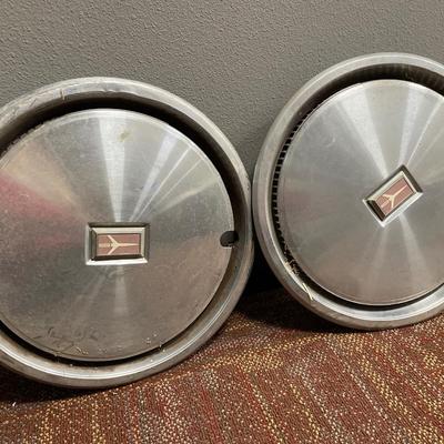 4 Vintage Oldsmobile hubcaps