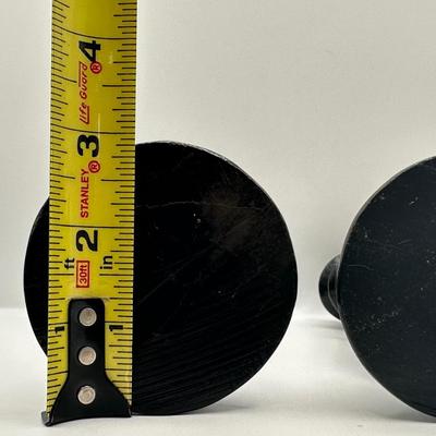 Pair of Carved Black Stone Candlesticks