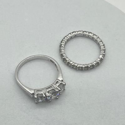 LOT 424: Two Sterling Silver Cubic Zirconia Rings - Size 8 and 9 - 6.4 GTW