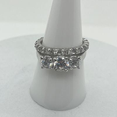 LOT 424: Two Sterling Silver Cubic Zirconia Rings - Size 8 and 9 - 6.4 GTW