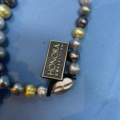 Sale Photo Thumbnail #445: Still with tag.  Sterling clasp