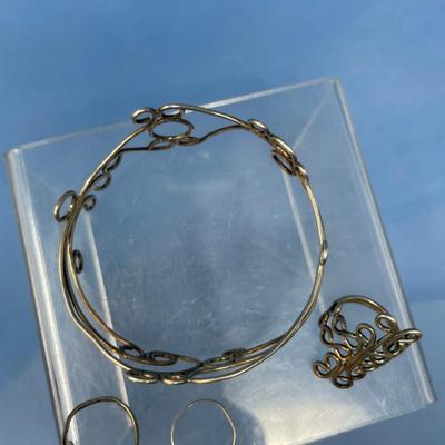 Sale Photo Thumbnail #487: 19.5 grams total weight.  Bracelet & 3 rings.  Rings are size 8 approximately.