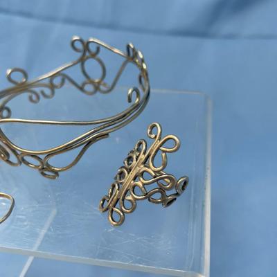 Sale Photo Thumbnail #488: 19.5 grams total weight.  Bracelet & 3 rings.  Rings are size 8 approximately.