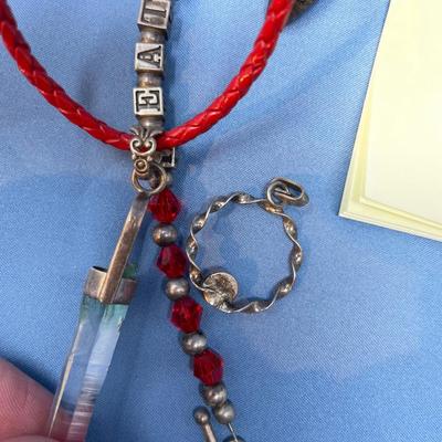 Sale Photo Thumbnail #518: Crystals & a Heather bracelet.  29.5 grams total weight (leather strap included)