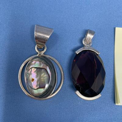 Sale Photo Thumbnail #532: The one on the right is amethyst color. 26.4 grams total weight.