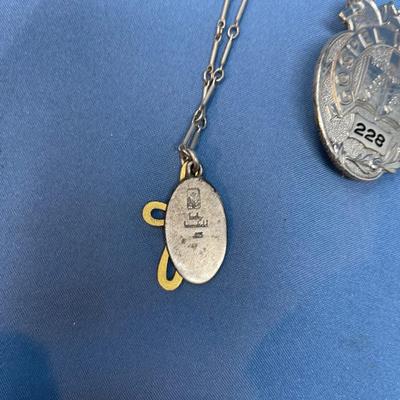 Sale Photo Thumbnail #547: The badges are cool!  The necklace has a brass heart.  25.9 grams total weight.