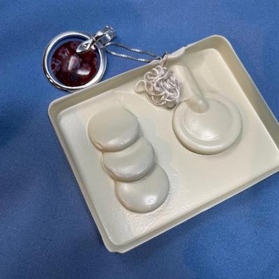 Sale Photo Thumbnail #576: New in box!  4 interchangeable glass discs. Sterling silver frame and chain.