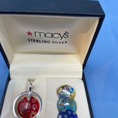 Sale Photo Thumbnail #575: New in box!  4 interchangeable glass discs. Sterling silver frame and chain.