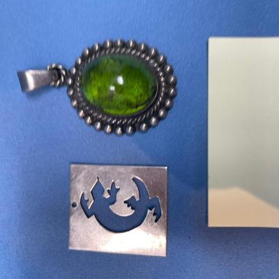 Sale Photo Thumbnail #583: M. Slim salamander sterling piece.  Green Apple Amber pendant.  Both in great shape! 19.1 grams total weight.