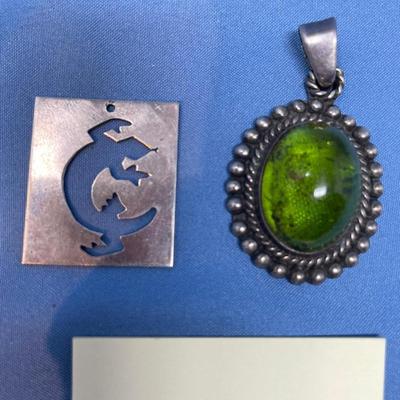 Sale Photo Thumbnail #582: M. Slim salamander sterling piece.  Green Apple Amber pendant.  Both in great shape! 19.1 grams total weight.