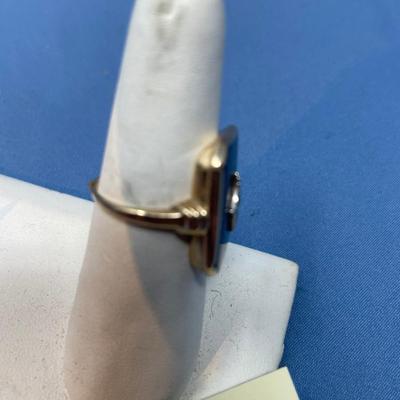 Sale Photo Thumbnail #605: Today this would be considered a ladies ring, but in the 1920s when it was made, it was for a man.
Ring needs band repair, so it can be sized to whatever you need.  Or make it into a pendant! 4.9 grams total weight.