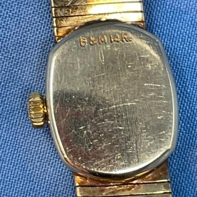 Sale Photo Thumbnail #625: B&M Square 80s ladies watch.
14K gold band as well.
Light scratching on the back of
case.  Works great, keeps good time.
20.2 grams total weight (movement not included)
That's a lot of gold!