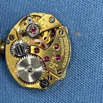 Sale Photo Thumbnail #629: B&M Square 80s ladies watch.
14K gold band as well.
Light scratching on the back of
case.  Works great, keeps good time.
20.2 grams total weight (movement not included)
That's a lot of gold!