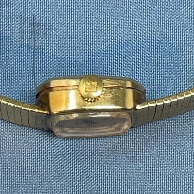 Sale Photo Thumbnail #630: B&M Square 80s ladies watch.
14K gold band as well.
Light scratching on the back of
case.  Works great, keeps good time.
20.2 grams total weight (movement not included)
That's a lot of gold!