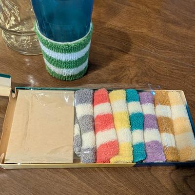 Large basket with jars, vintage party coasters, and other baskets.