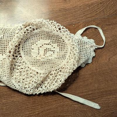 Variety for doillies, table cover, and a bonnet.