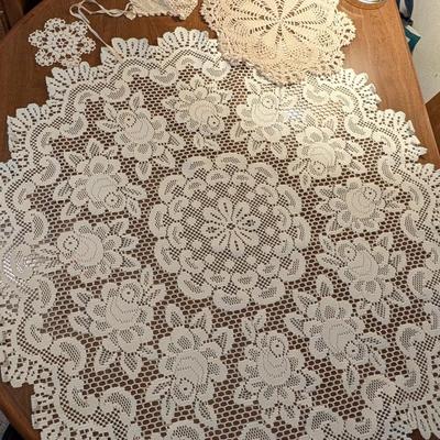 Variety for doillies, table cover, and a bonnet.