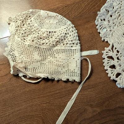 Variety for doillies, table cover, and a bonnet.