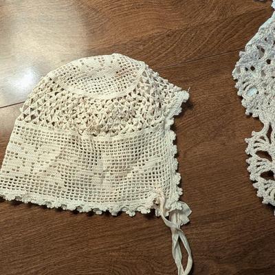 Variety for doillies, table cover, and a bonnet.